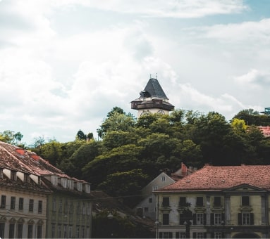 App Entwickler Graz — Schlossberg und grüne Hügel